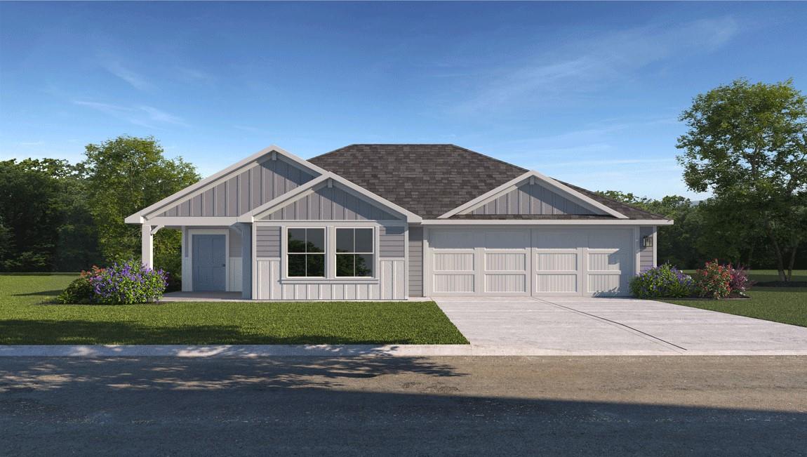 A welcoming facade showcases a two-car garage and