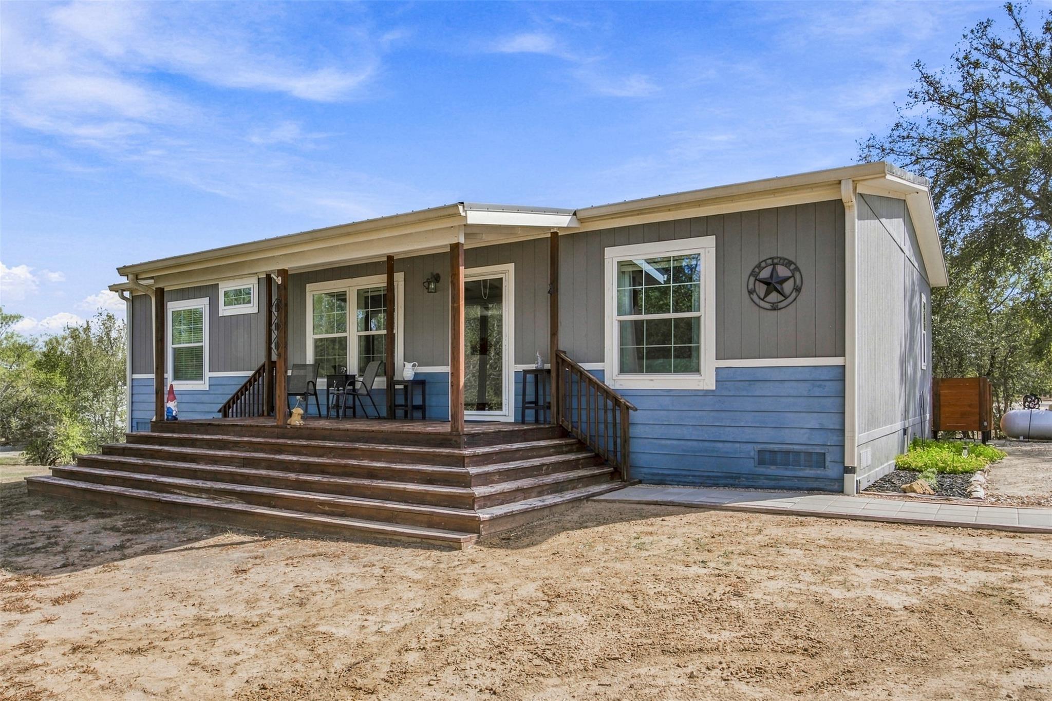 A spacious wooden front porch anchors this modern