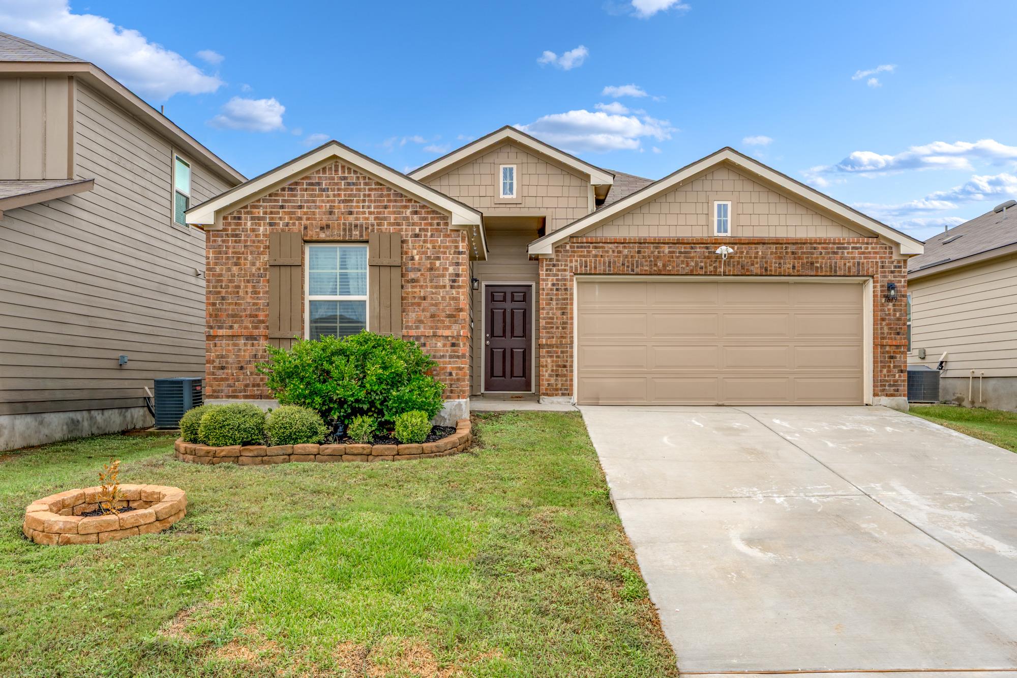 Classic brick and siding accents frame this welco