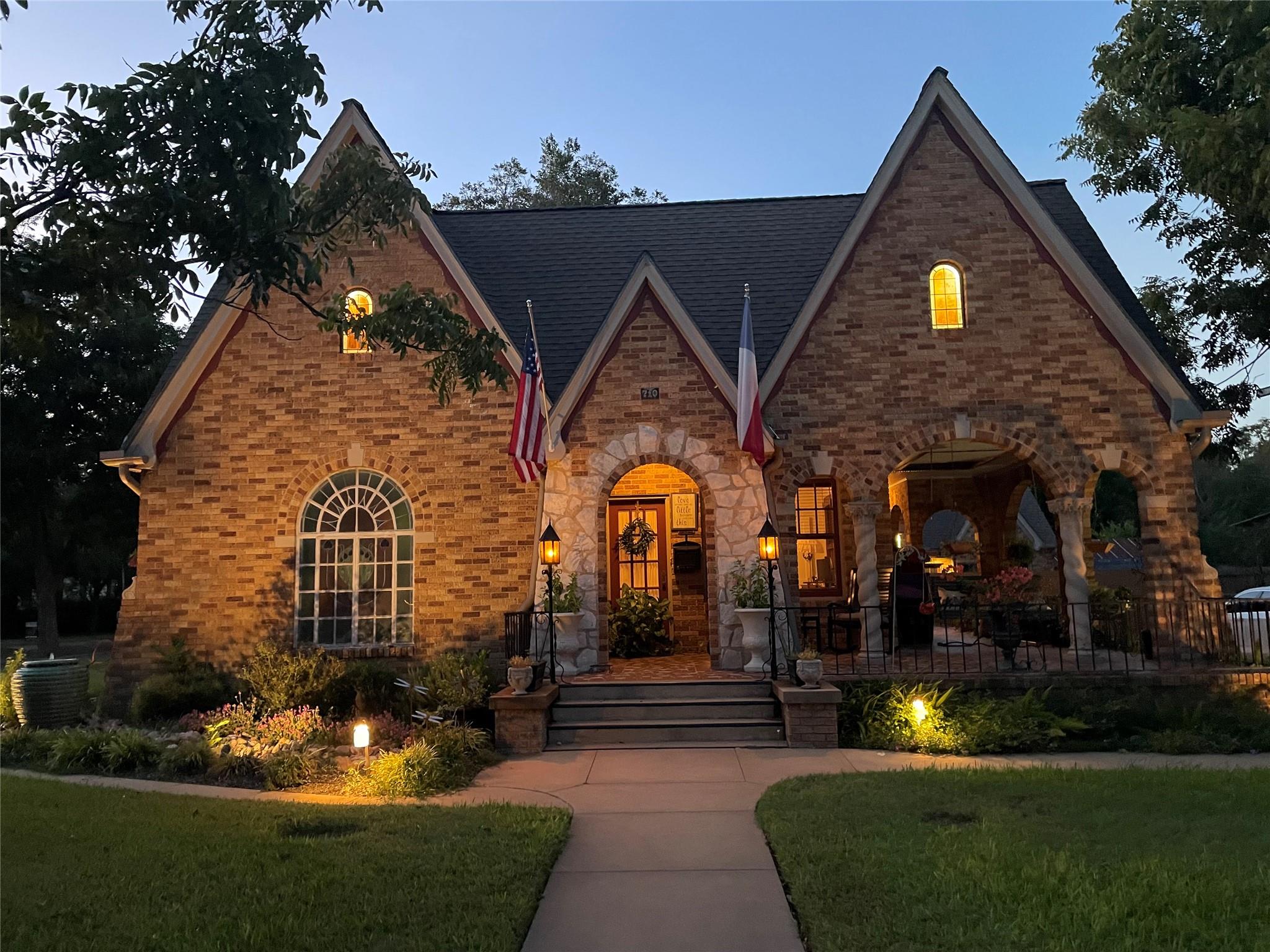 Dramatic gables and intricate brickwork define th