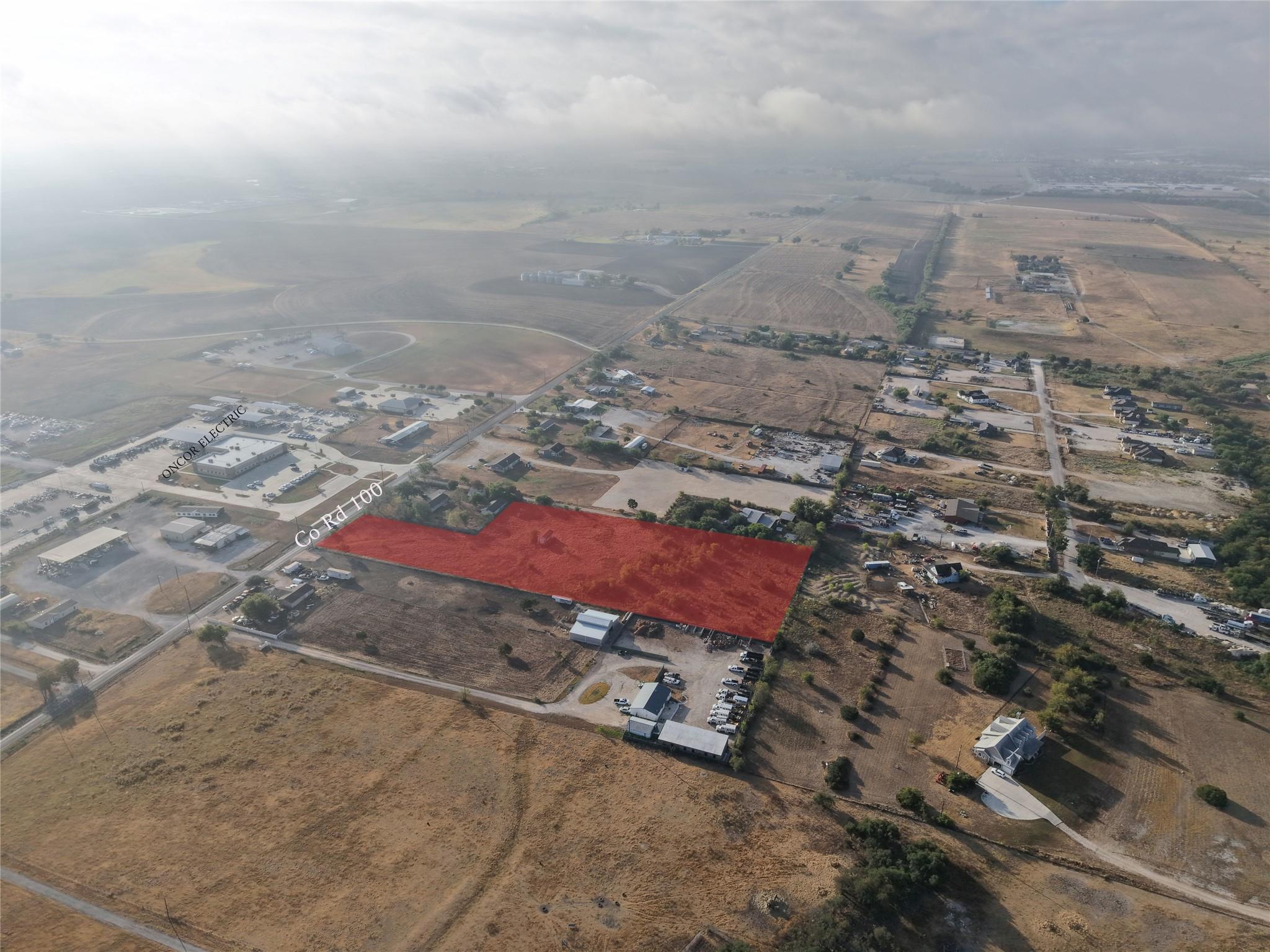 A spacious parcel highlighted in red sits bordere