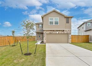 A spacious driveway leads directly to this contem
