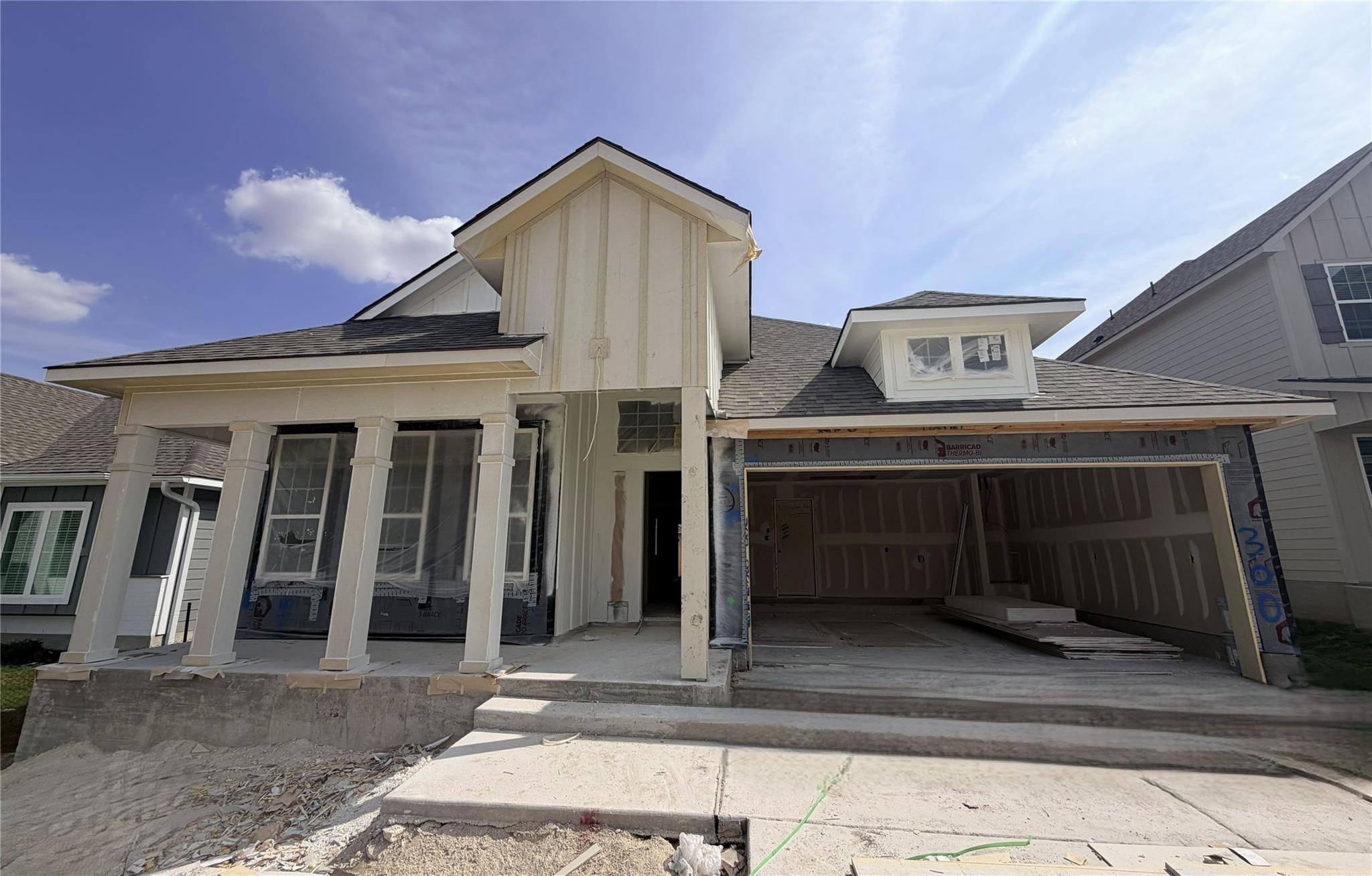 An inviting front porch and spacious garage highl