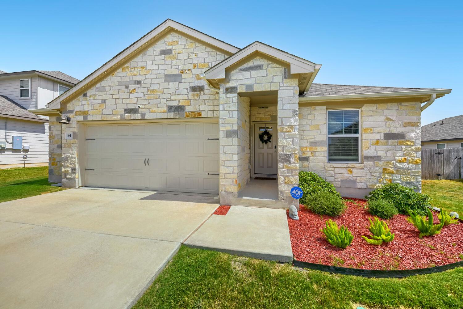 Natural stone masonry lends enduring style to thi