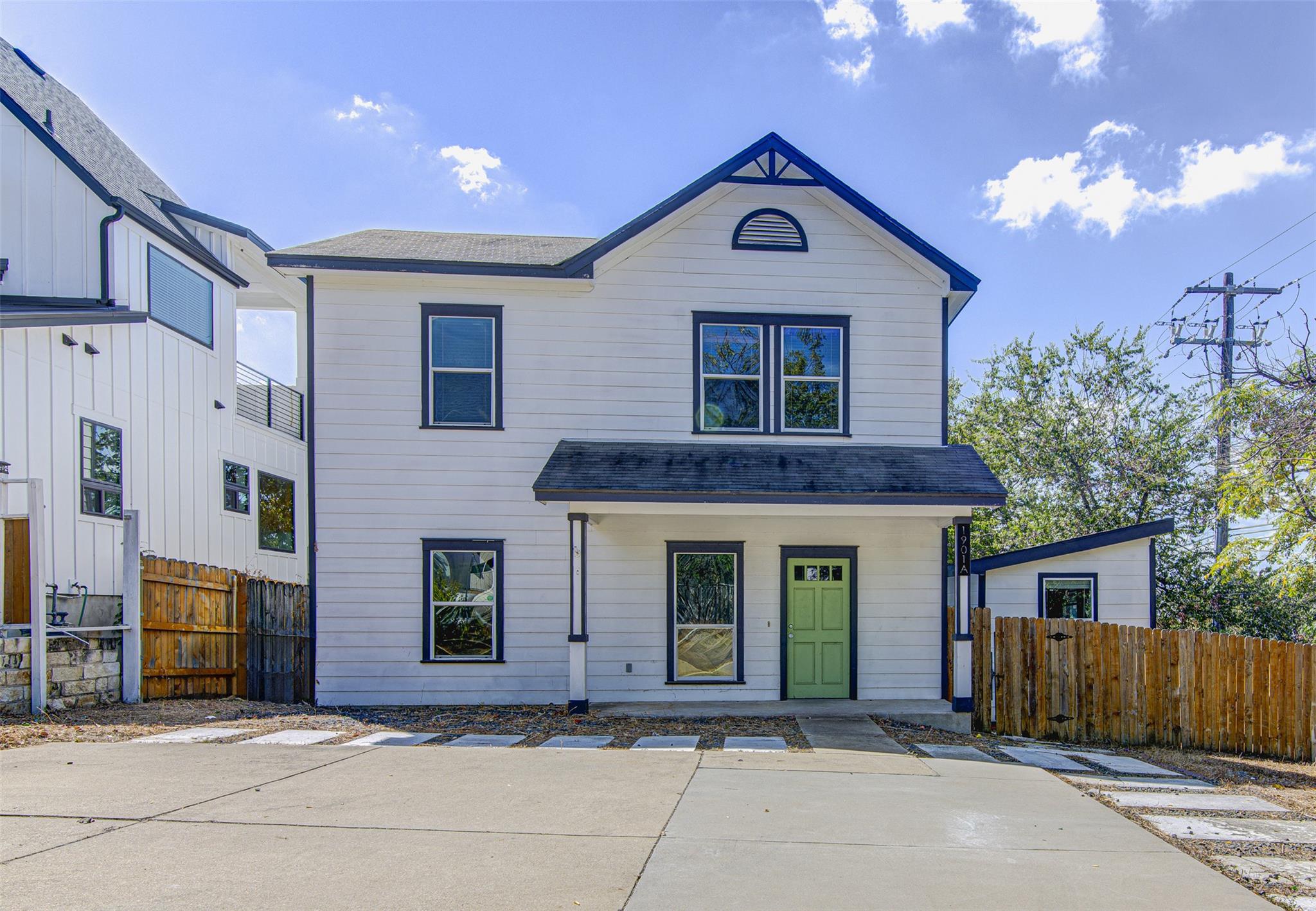 A classic two-story exterior showcases crisp sidi