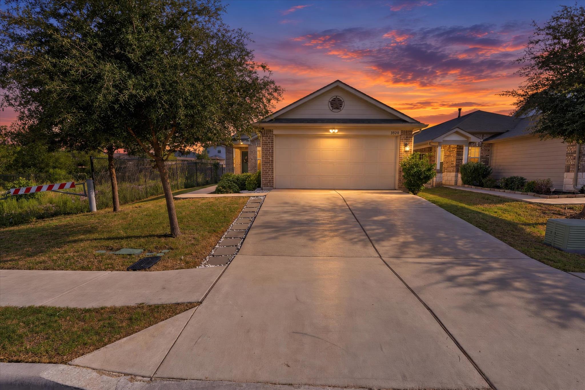 A wide concrete driveway leads toward the integra
