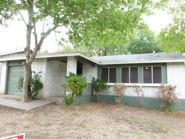 Mature trees shade the exterior of this classic b