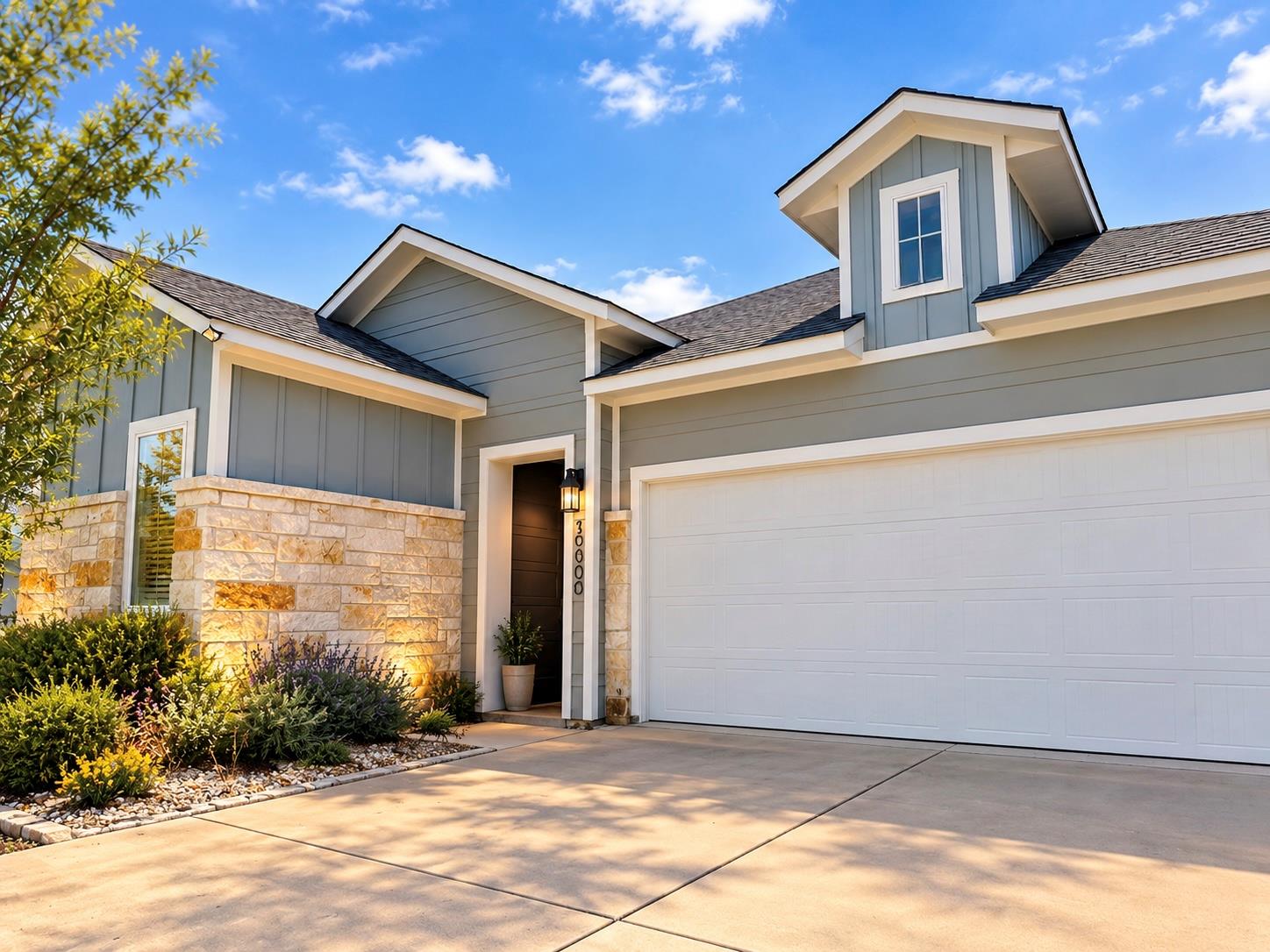 Board and batten siding pairs with natural stone 