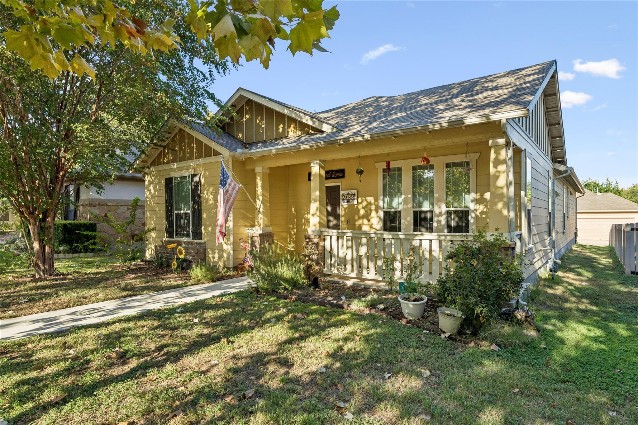 A welcoming front porch with classic wooden raili