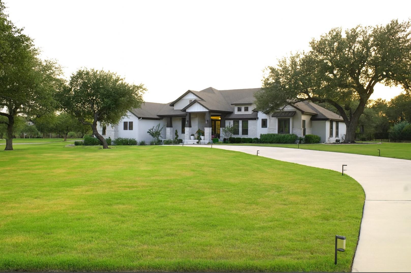 View of front facade with a front lawn and concre