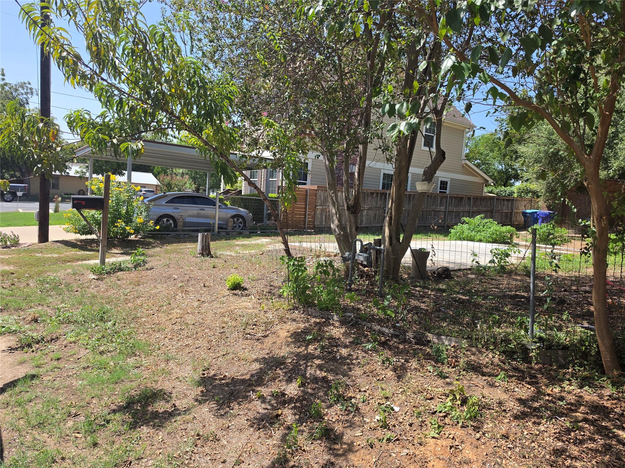 Mature trees shade a spacious yard space complete