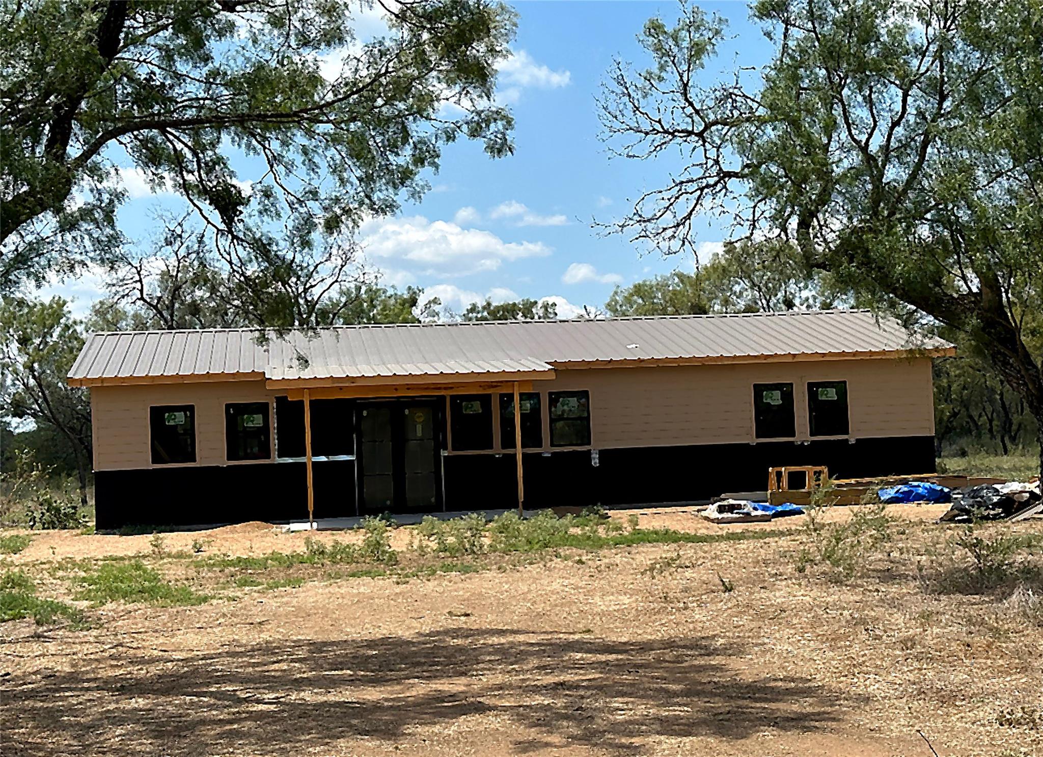 A metal roof covers this single-story structure f
