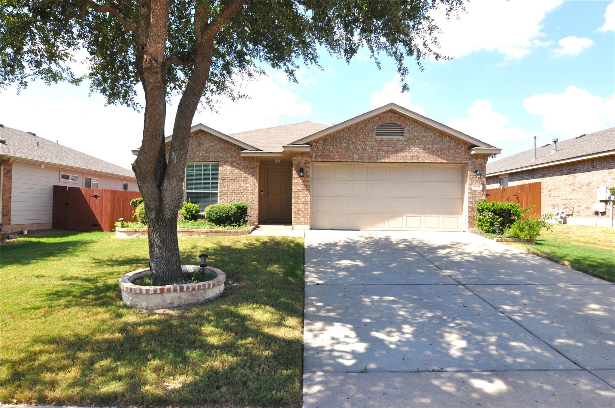 Classic brick exterior paired with a wide concret
