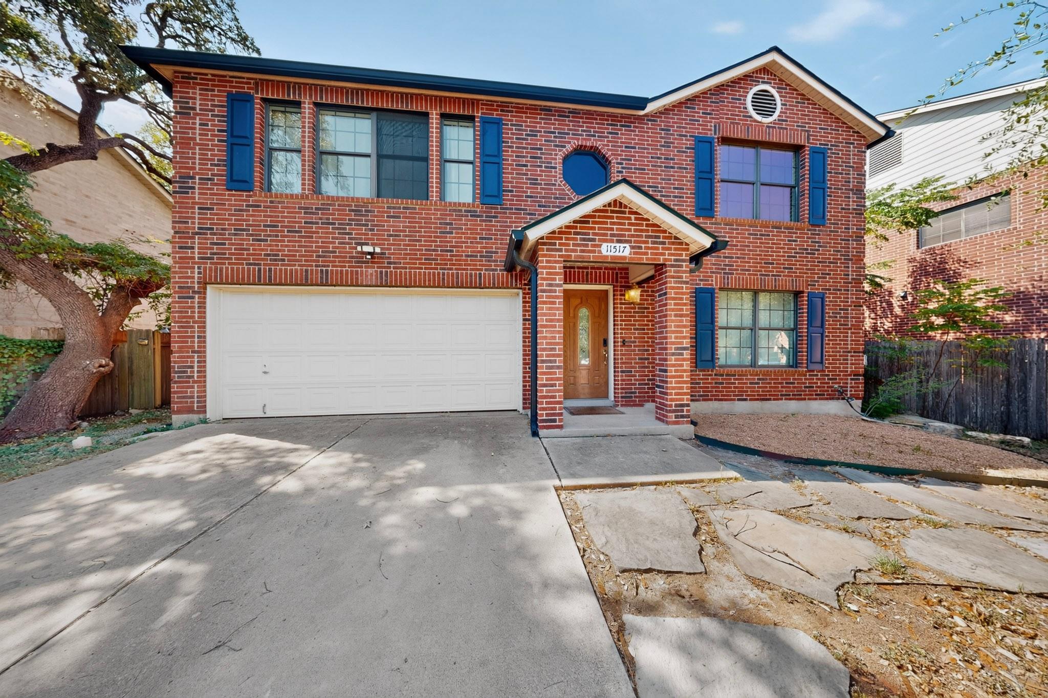 Timeless brick facade paired with a covered entry