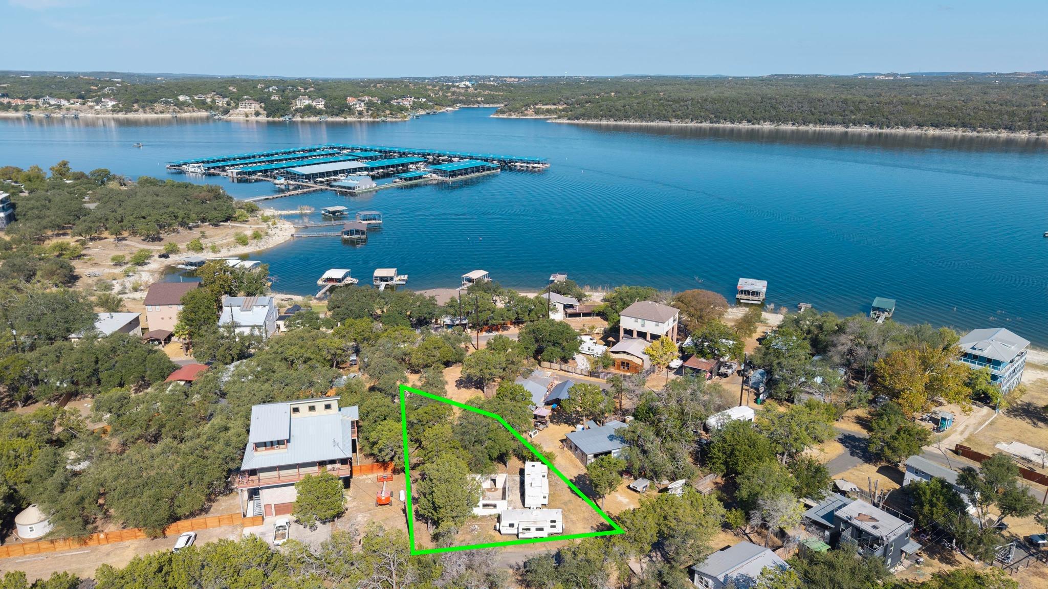 An aerial perspective showcases a lakeside proper
