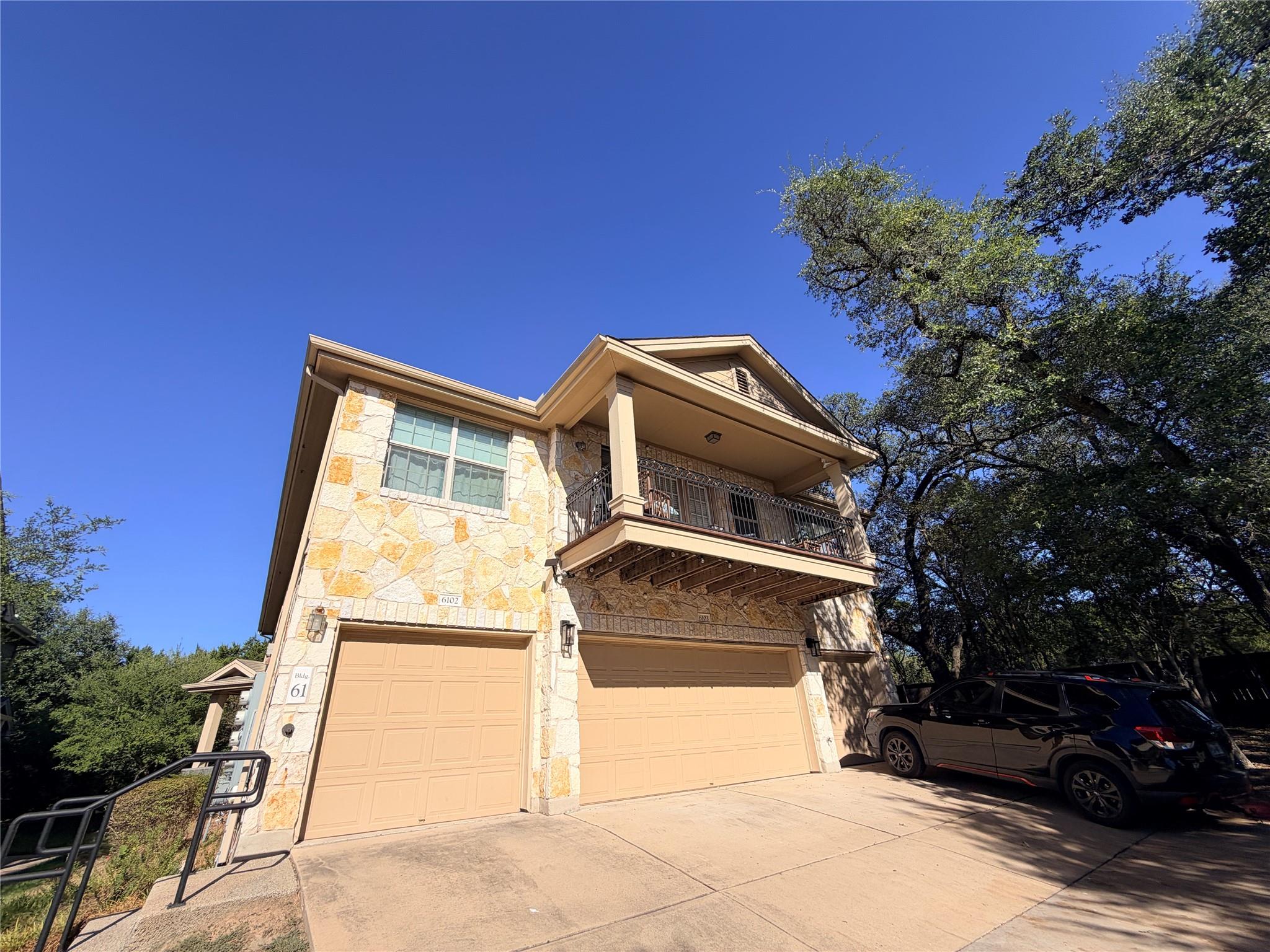 Stately stone masonry and a classic upper balcony