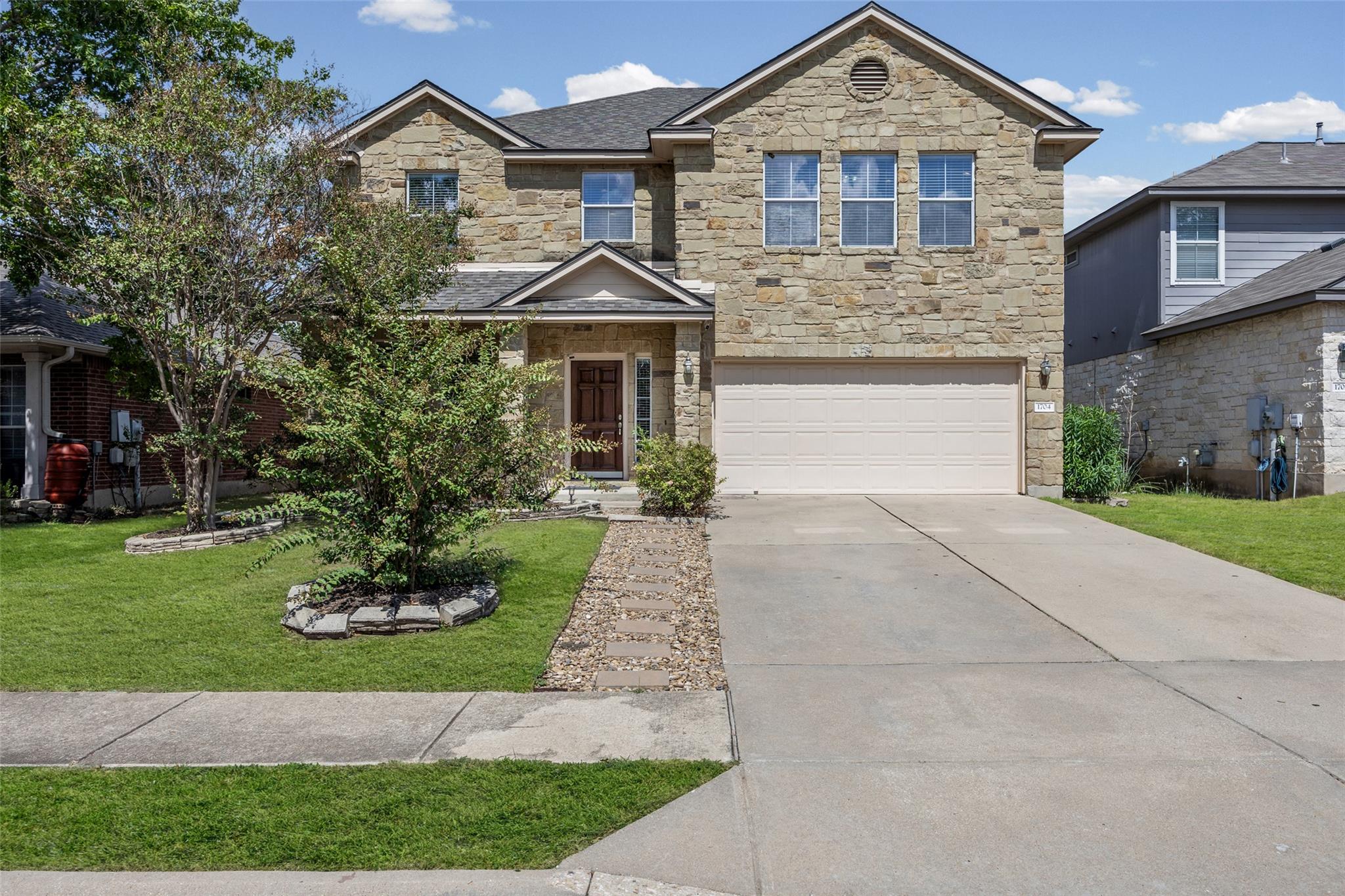 Stone masonry creates impressive curb appeal on t