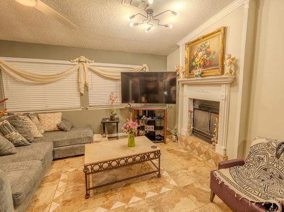 An ornate fireplace anchors this cozy living spac