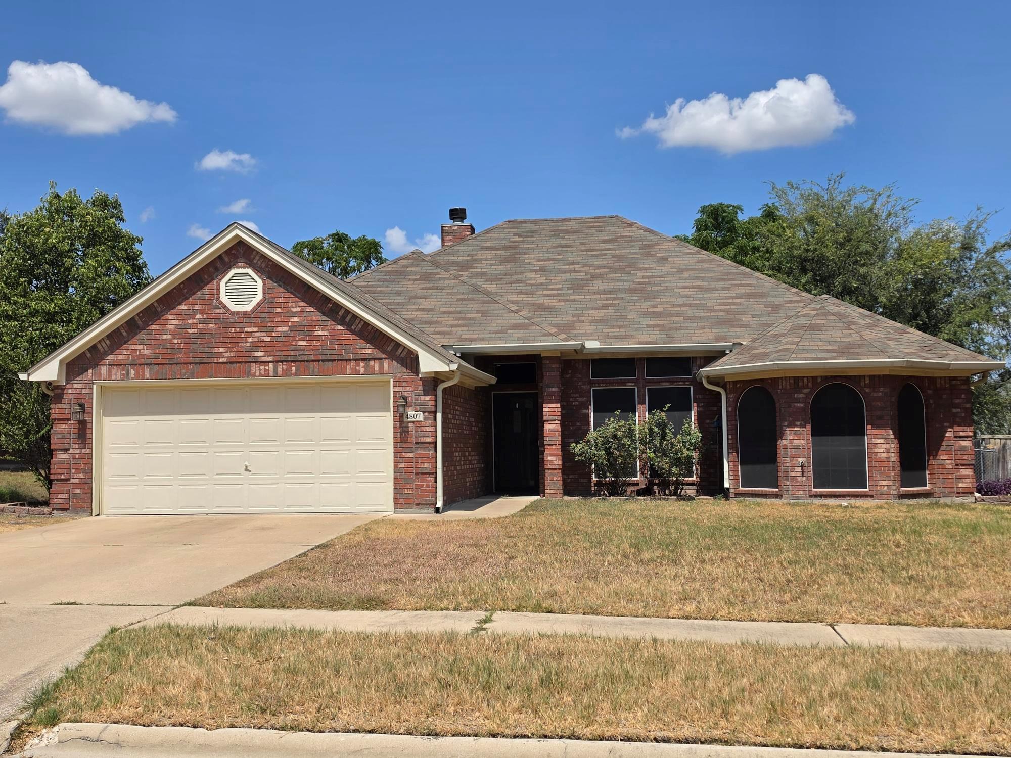 Classic brick elevation highlights this single-st