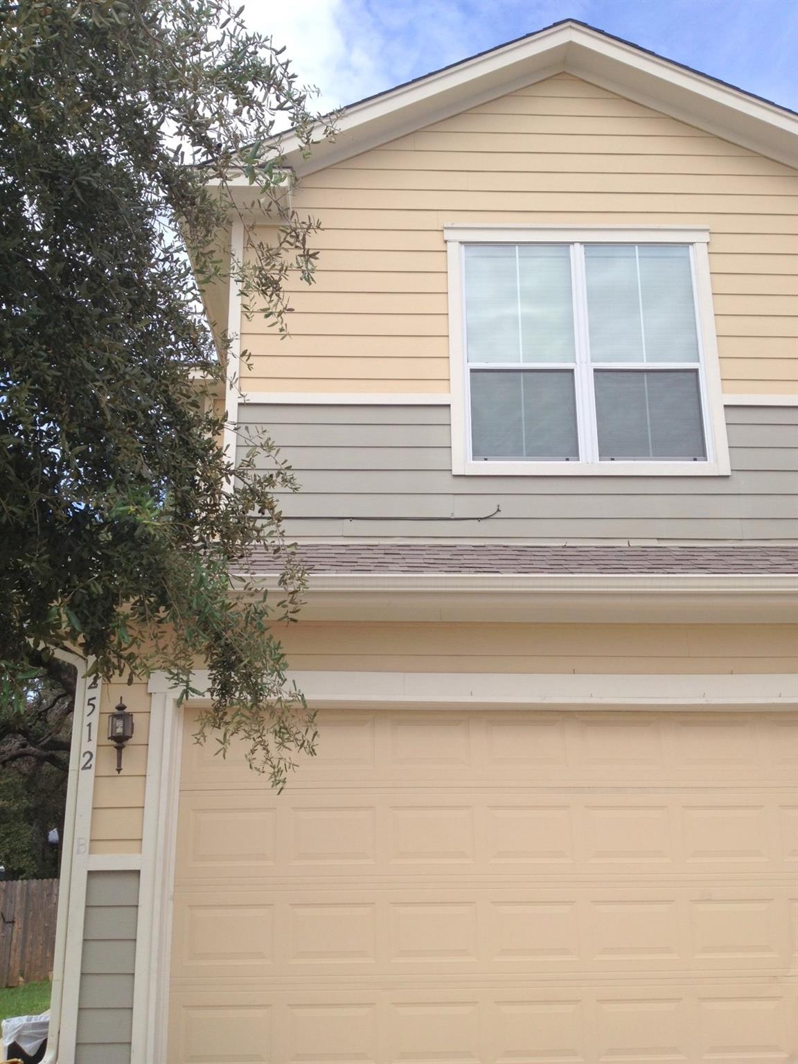 Multi-toned siding highlights the exterior archit