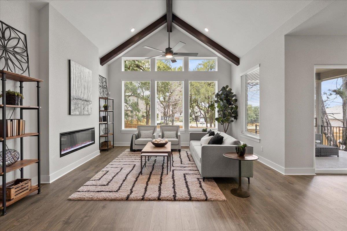Dramatic dark wood beams draw the eye upward in t