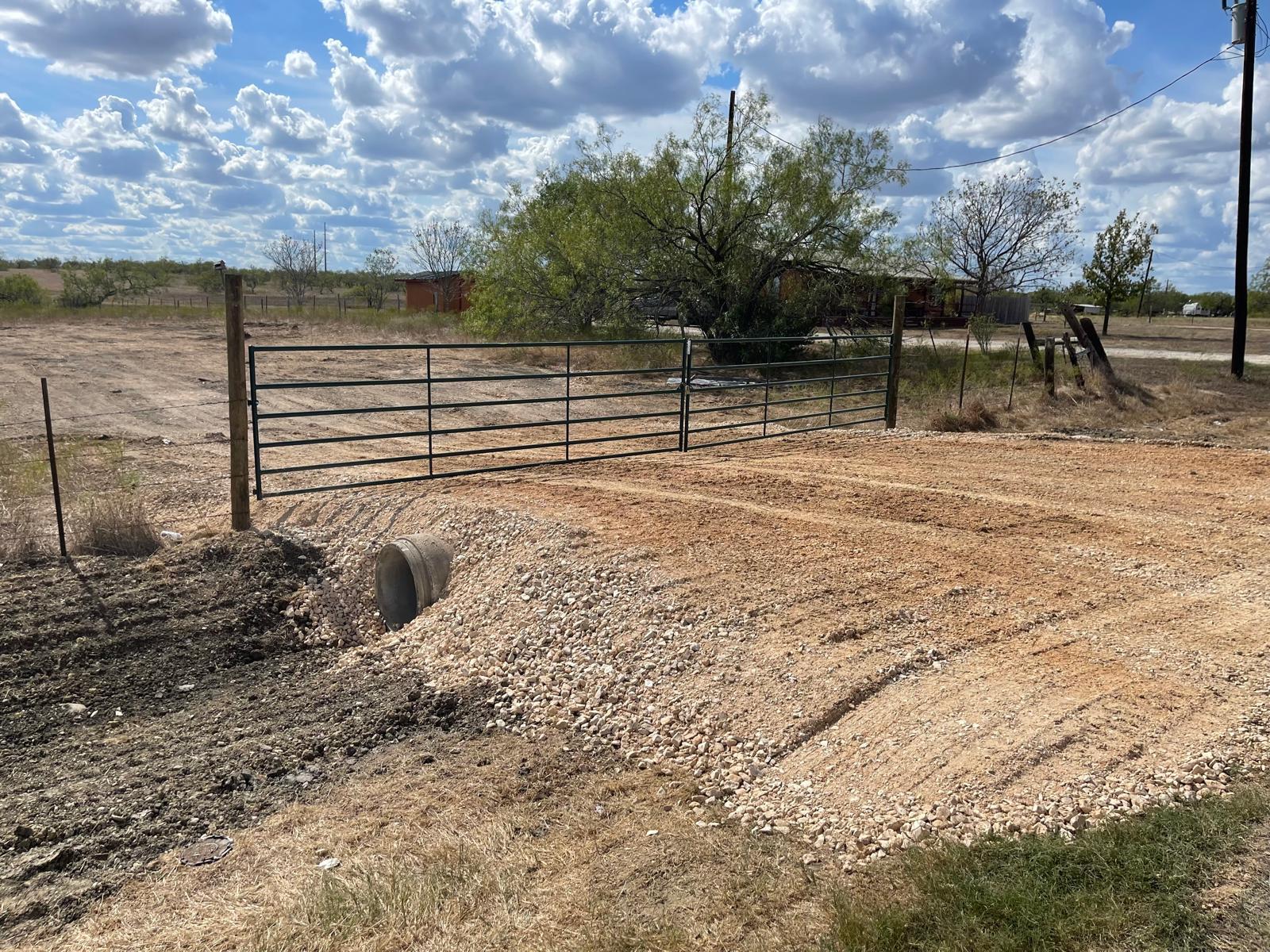 A metal security gate provides secure entry to th
