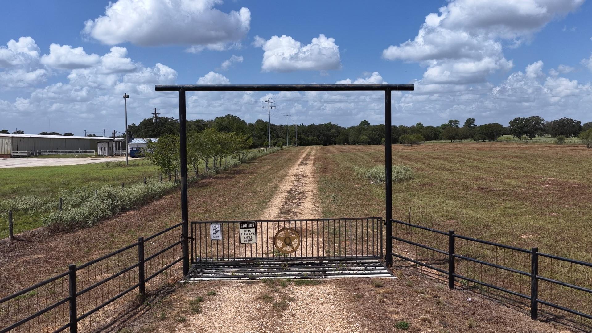 A metal gated entry secures the path leading into