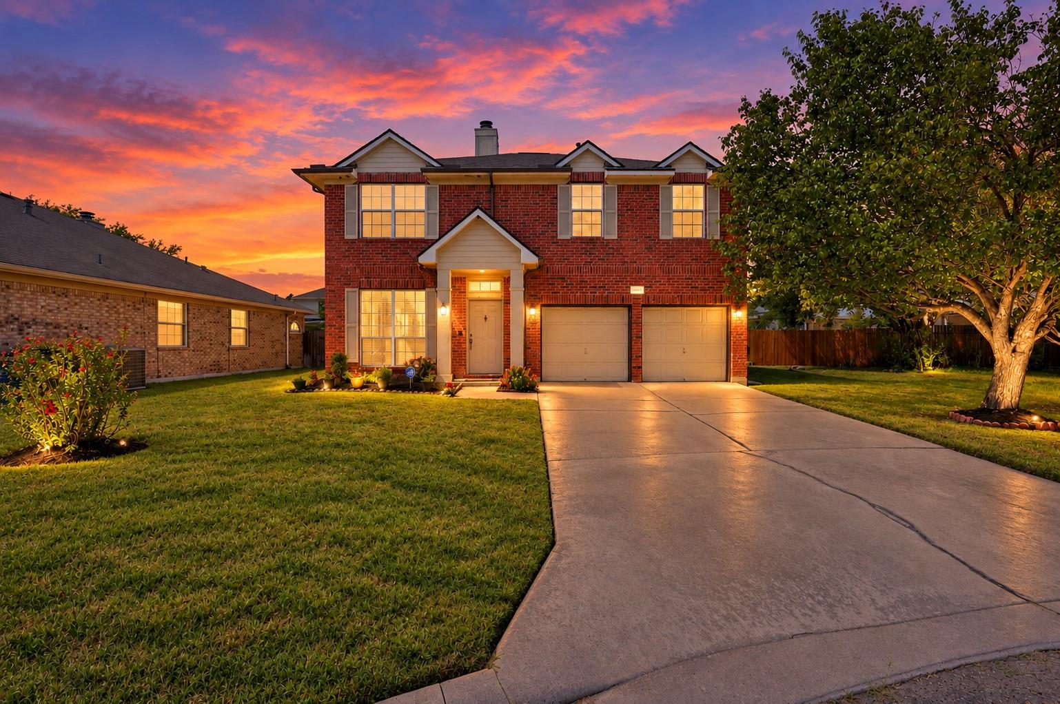 A classic brick exterior stands handsomely alongs