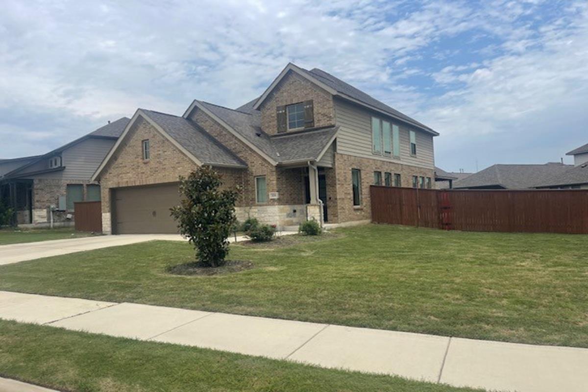 Multi-level gables and brick masonry define this 