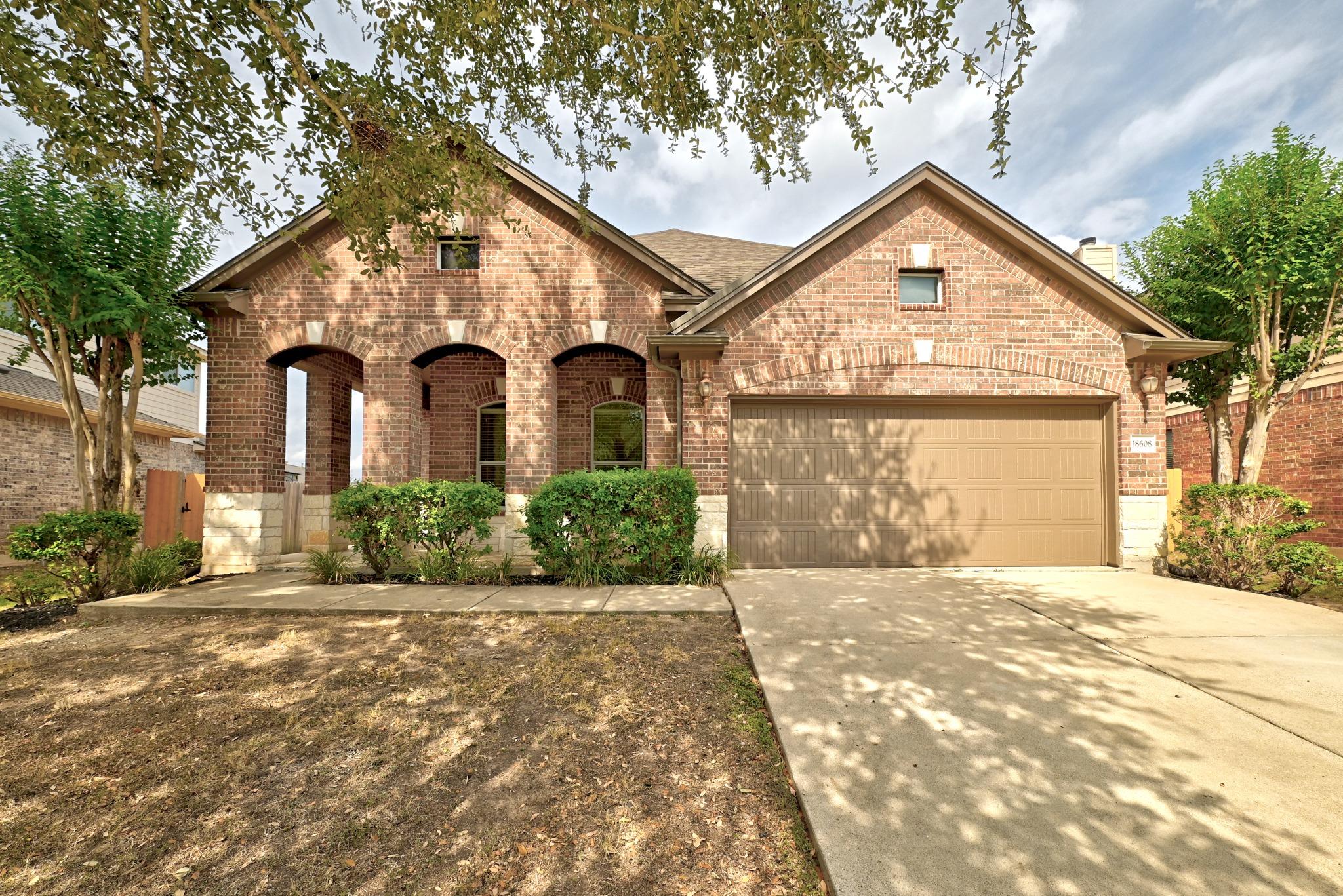 A classic brick exterior accented by stone detail