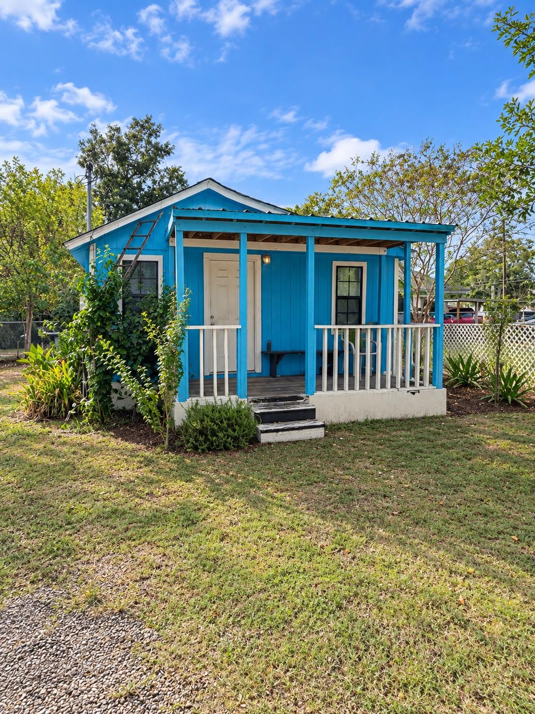A welcoming front porch leads into this charming 