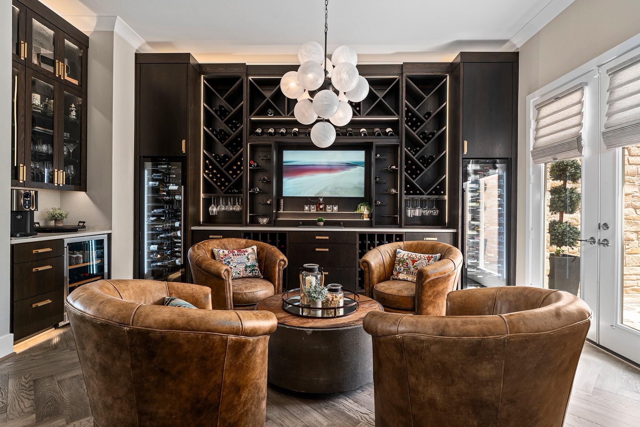 Rich wood built-ins and custom herringbone floori