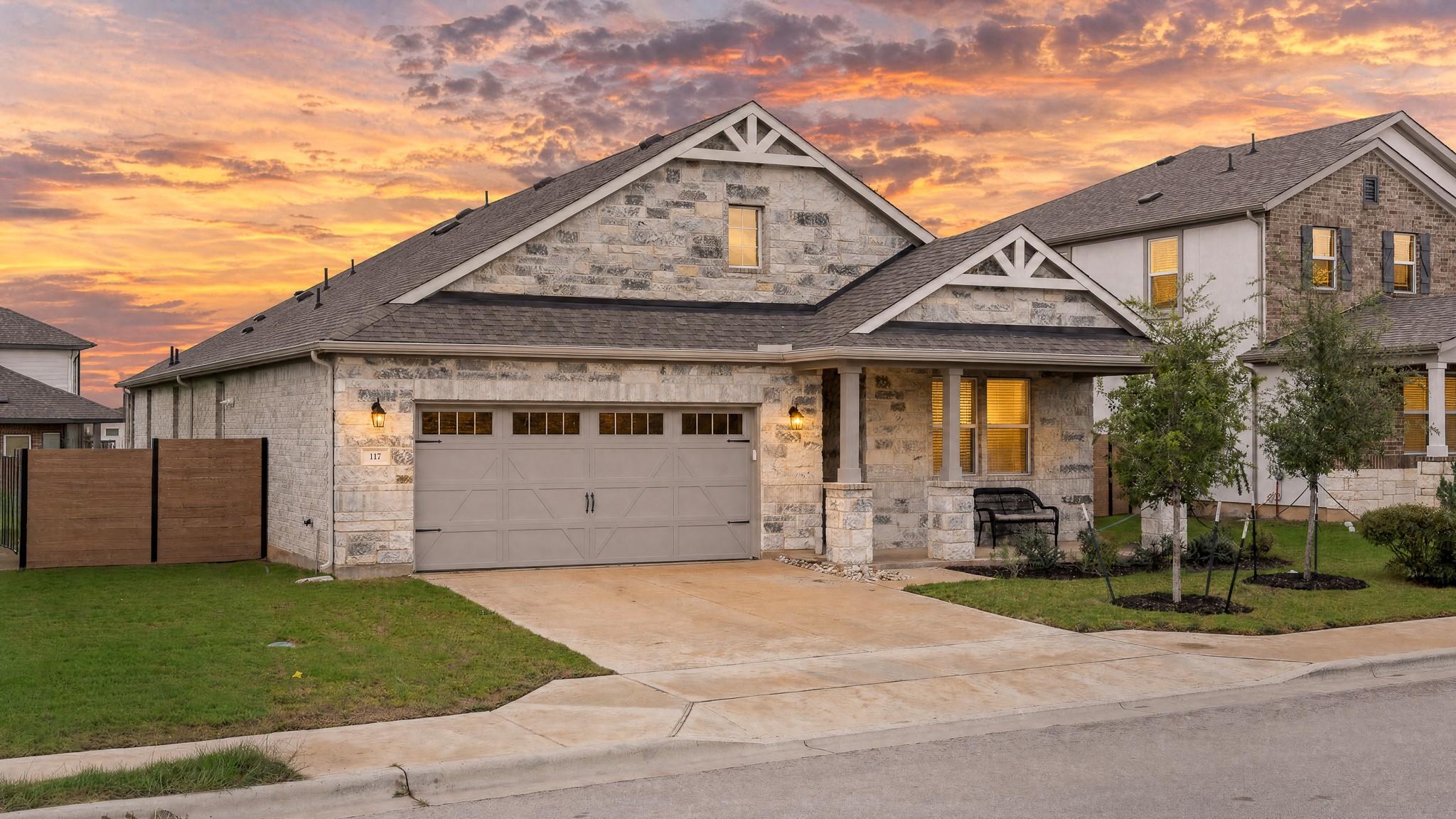 Textured stone veneer, striking gables, and a spa