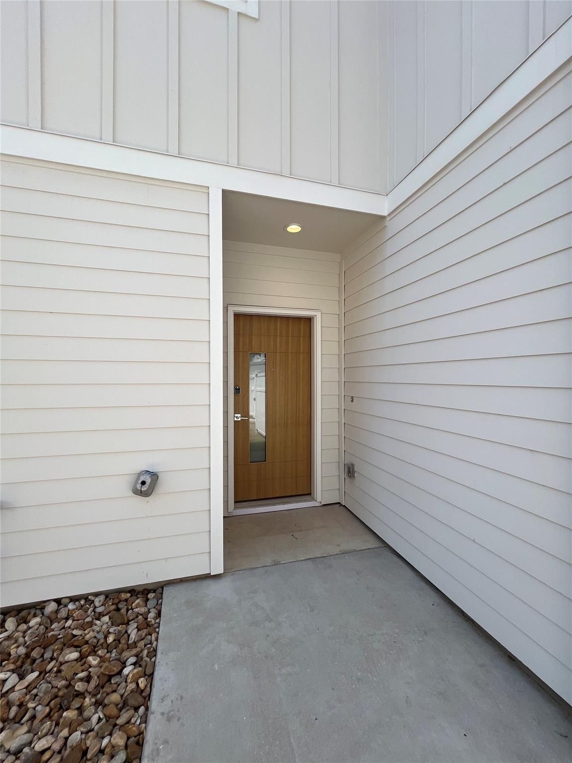 Clean lines and a modern wood door create a welco