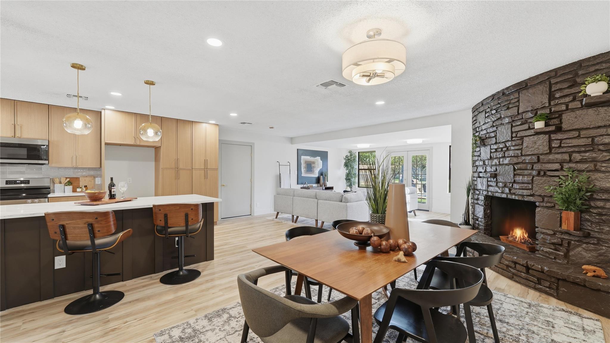 An open floorplan seamlessly connects the dining 