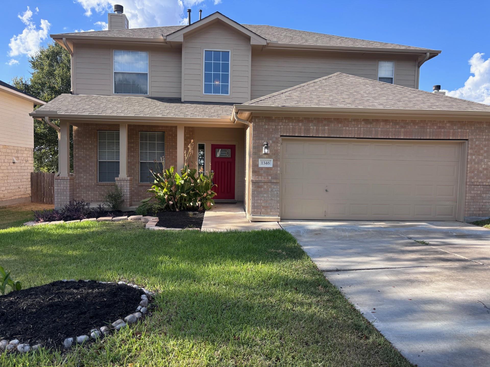 A classic two-story brick exterior greets visitor