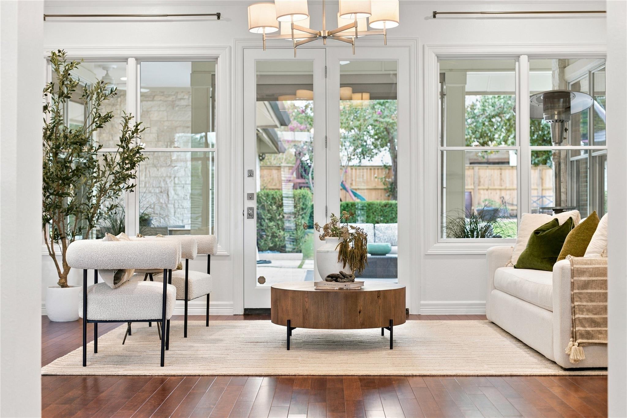 Gleaming hardwood floors and classic French doors