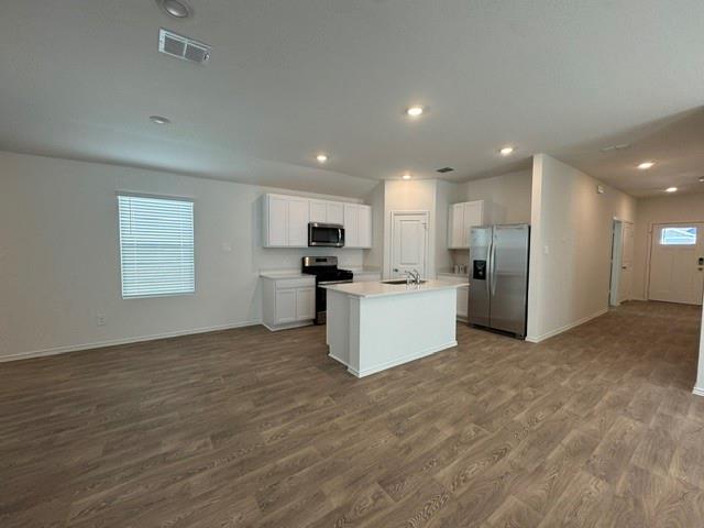 A spacious kitchen flows seamlessly into the main