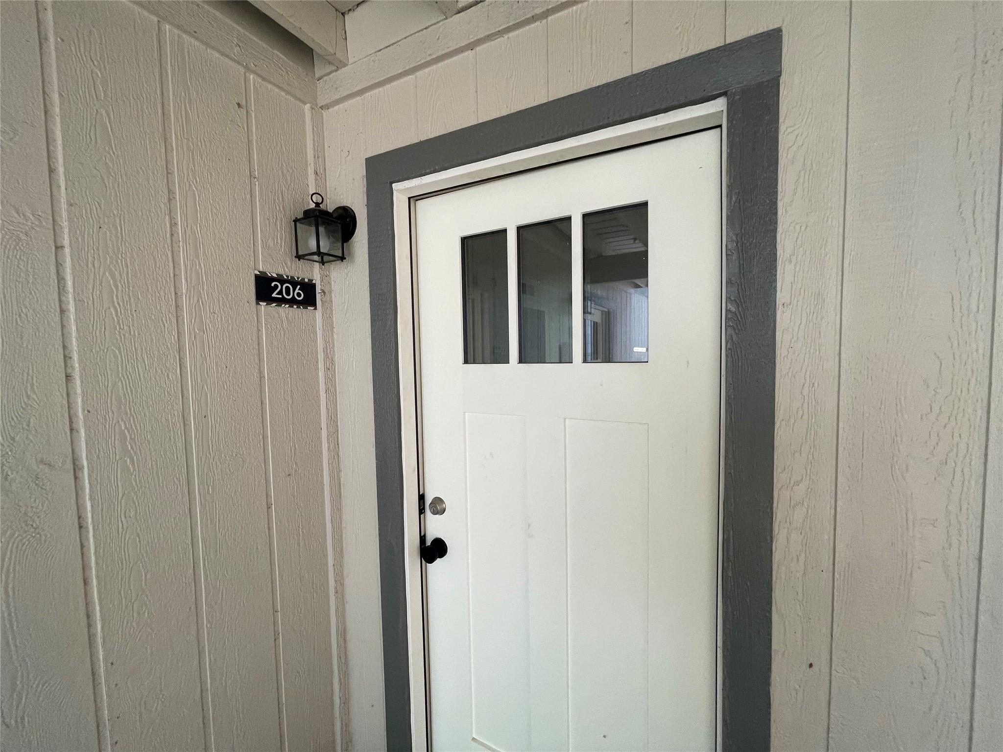 Craftsman style details frame a welcoming entry d