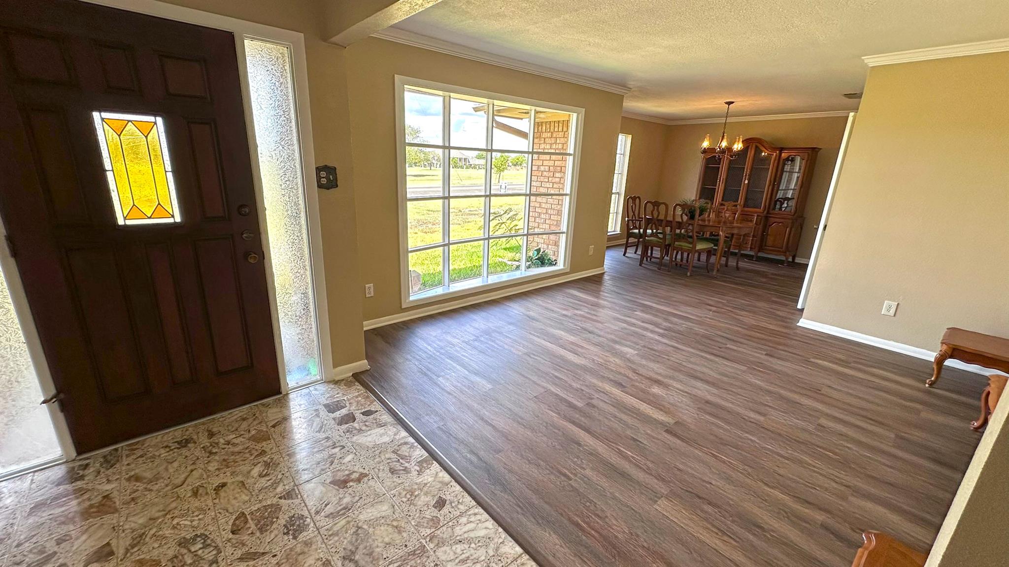 Gleaming hardwood floors and a broad multi-pane w