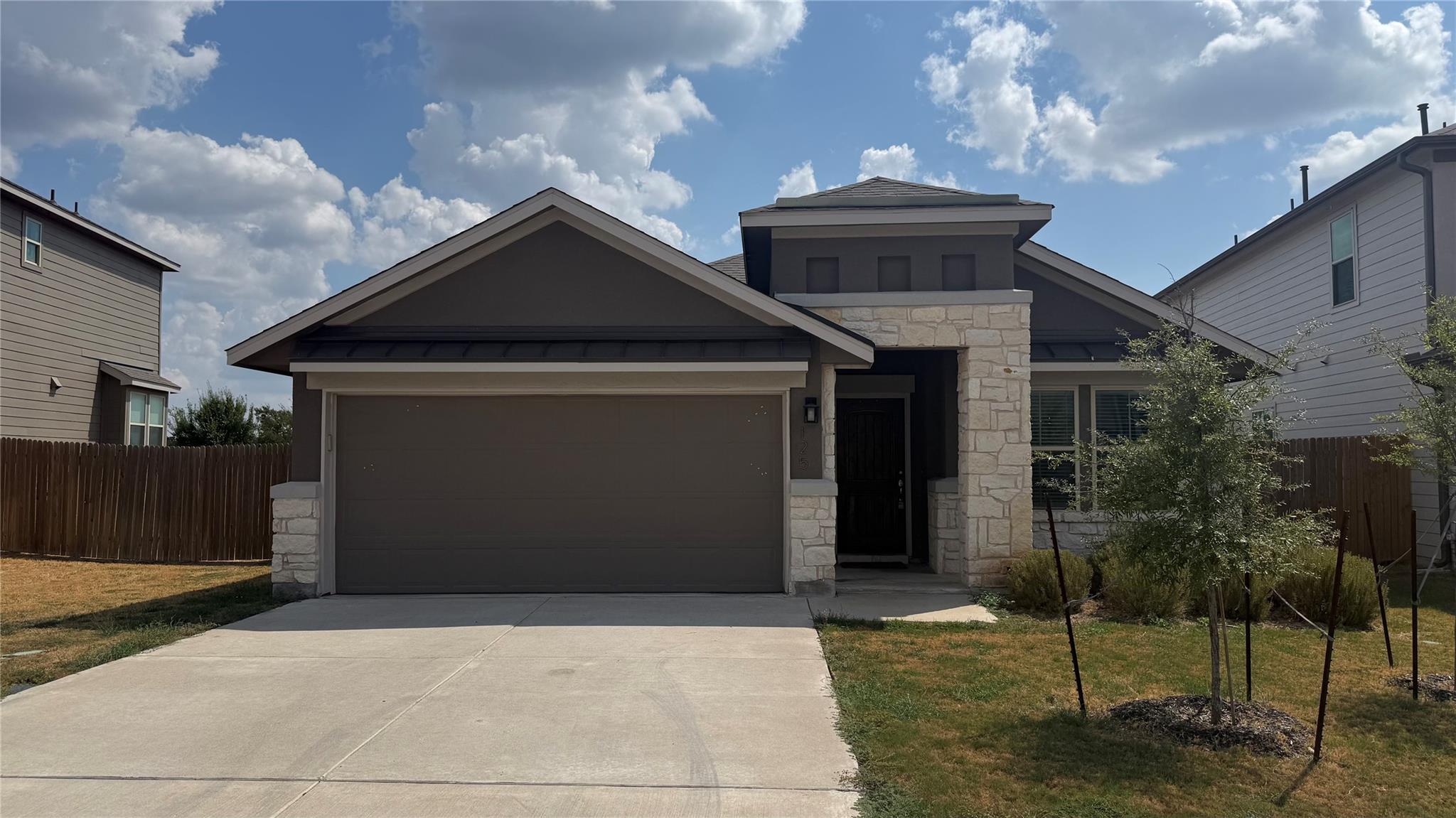 Clean architectural lines and stone accents defin