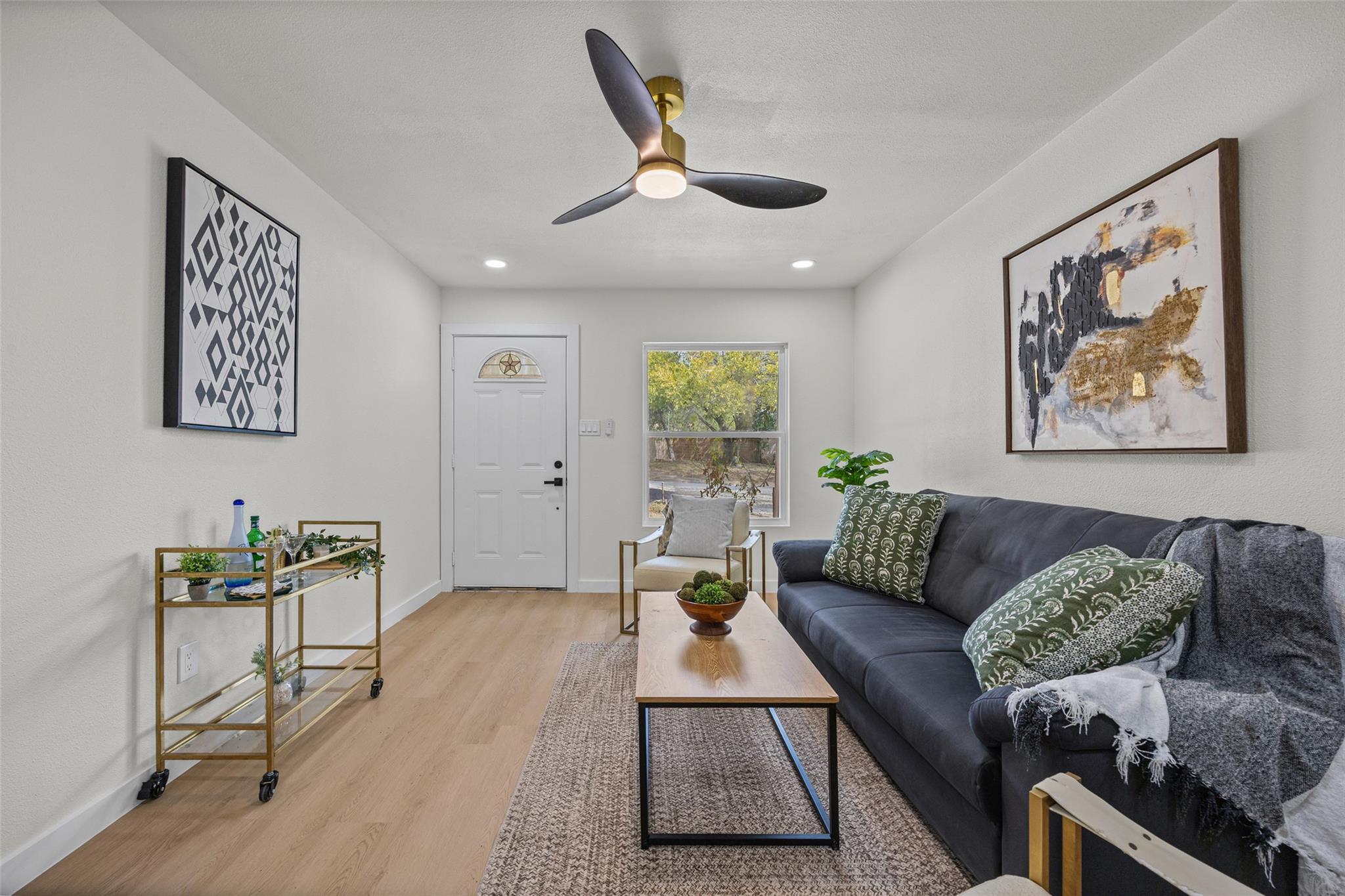 Smooth wood floors and crisp neutral walls create