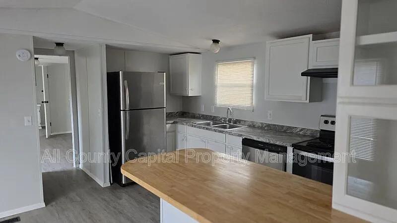 Functional kitchen design showcases white cabinet