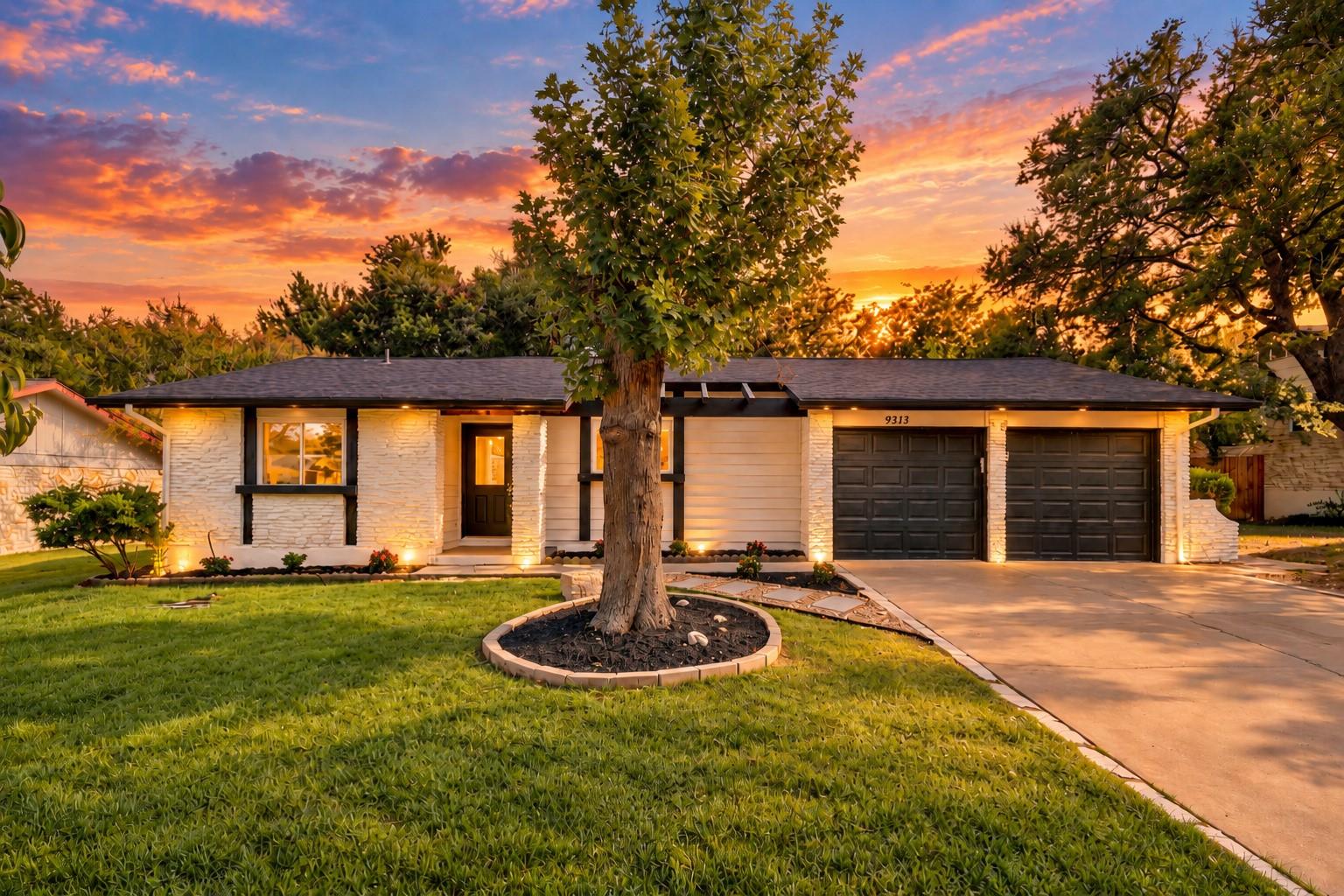 Lush green grass and mature trees frame this clas