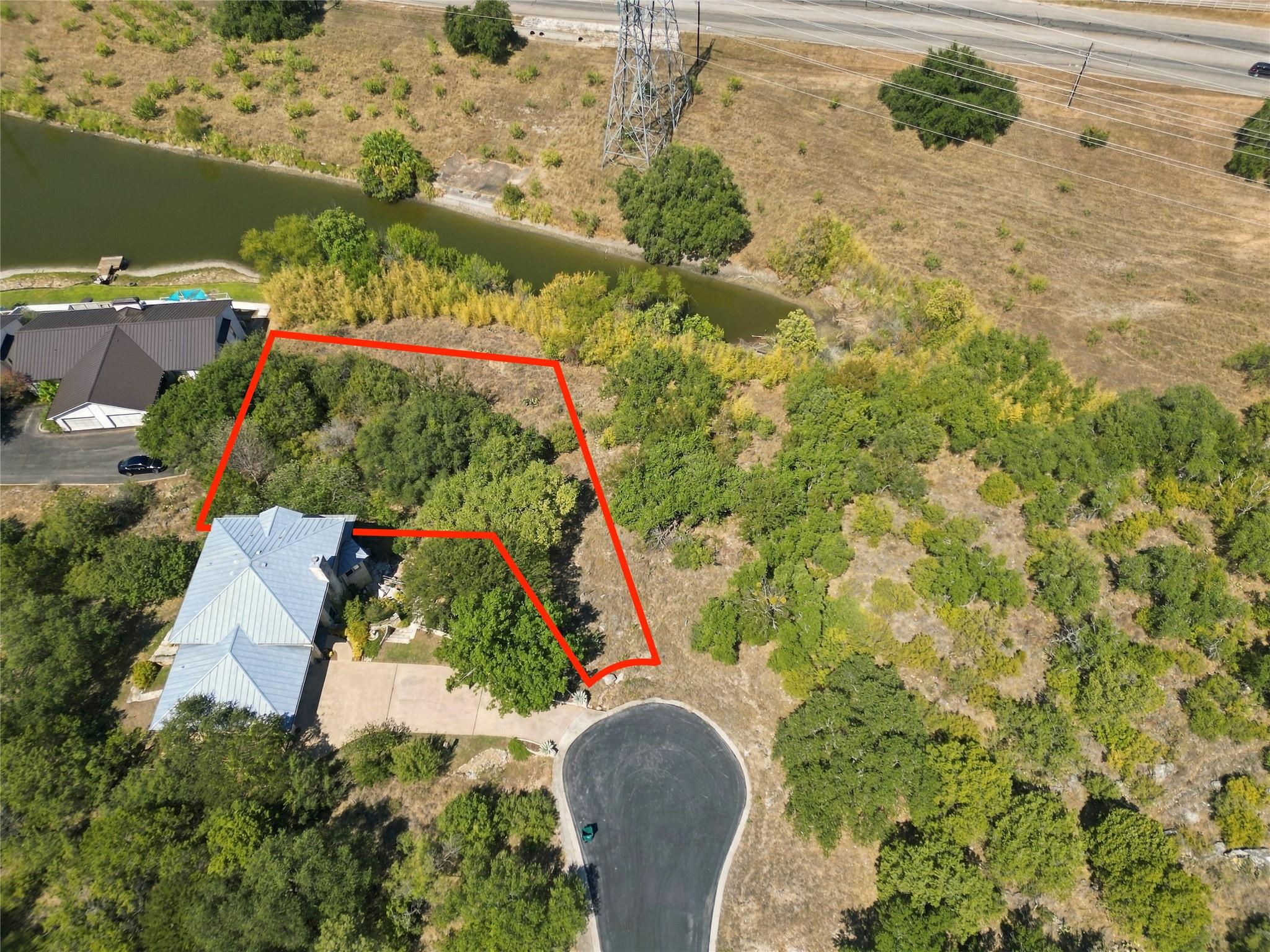 Mature trees surround the property boundary borde