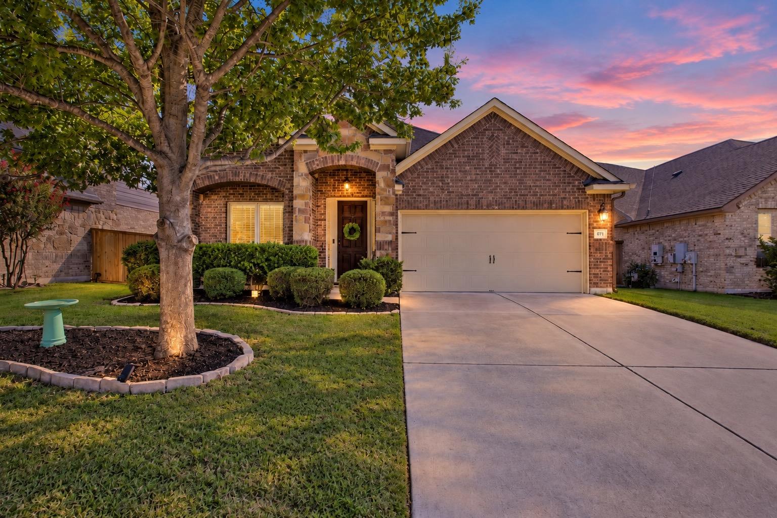 Classic brick exterior and manicured landscaping 