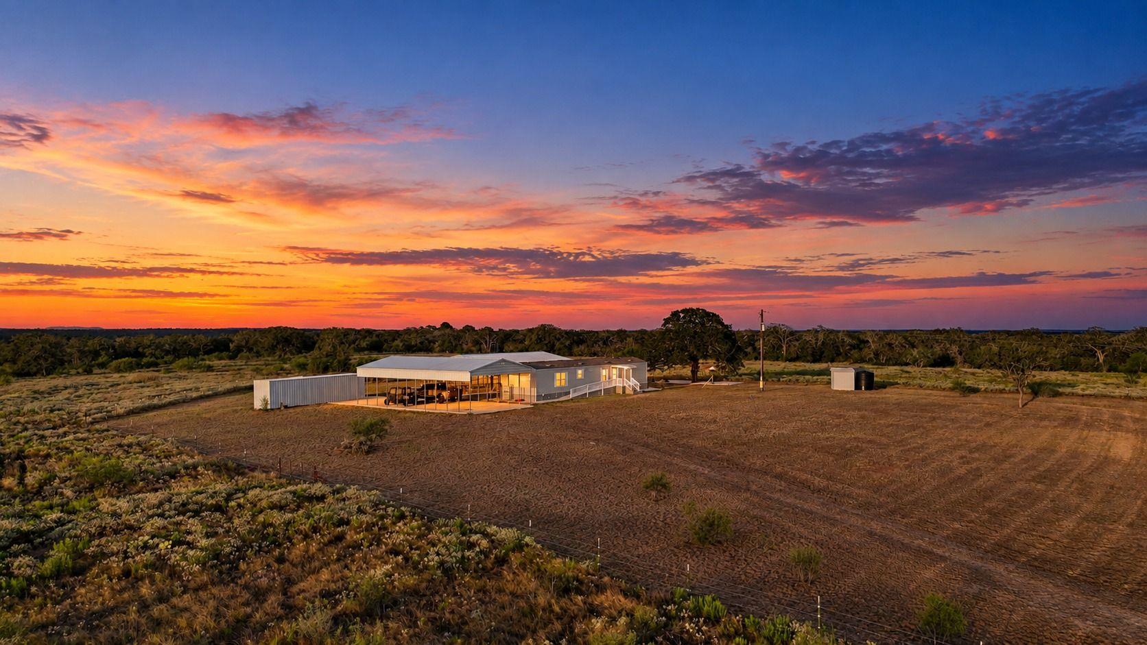 Expansive acreage surrounds the residential struc