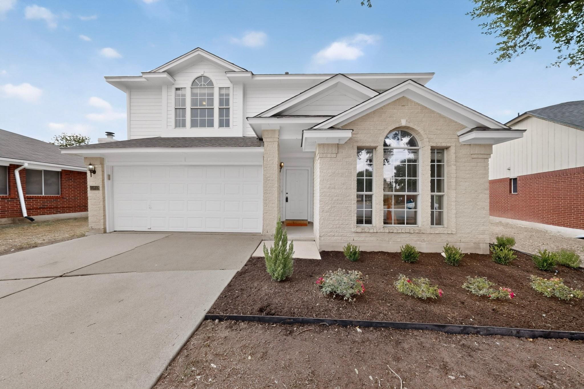 Gable rooflines and classic masonry accents defin