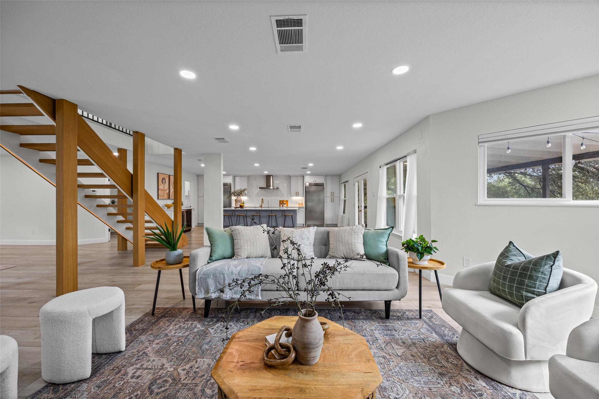 A spacious open concept living area connects dire