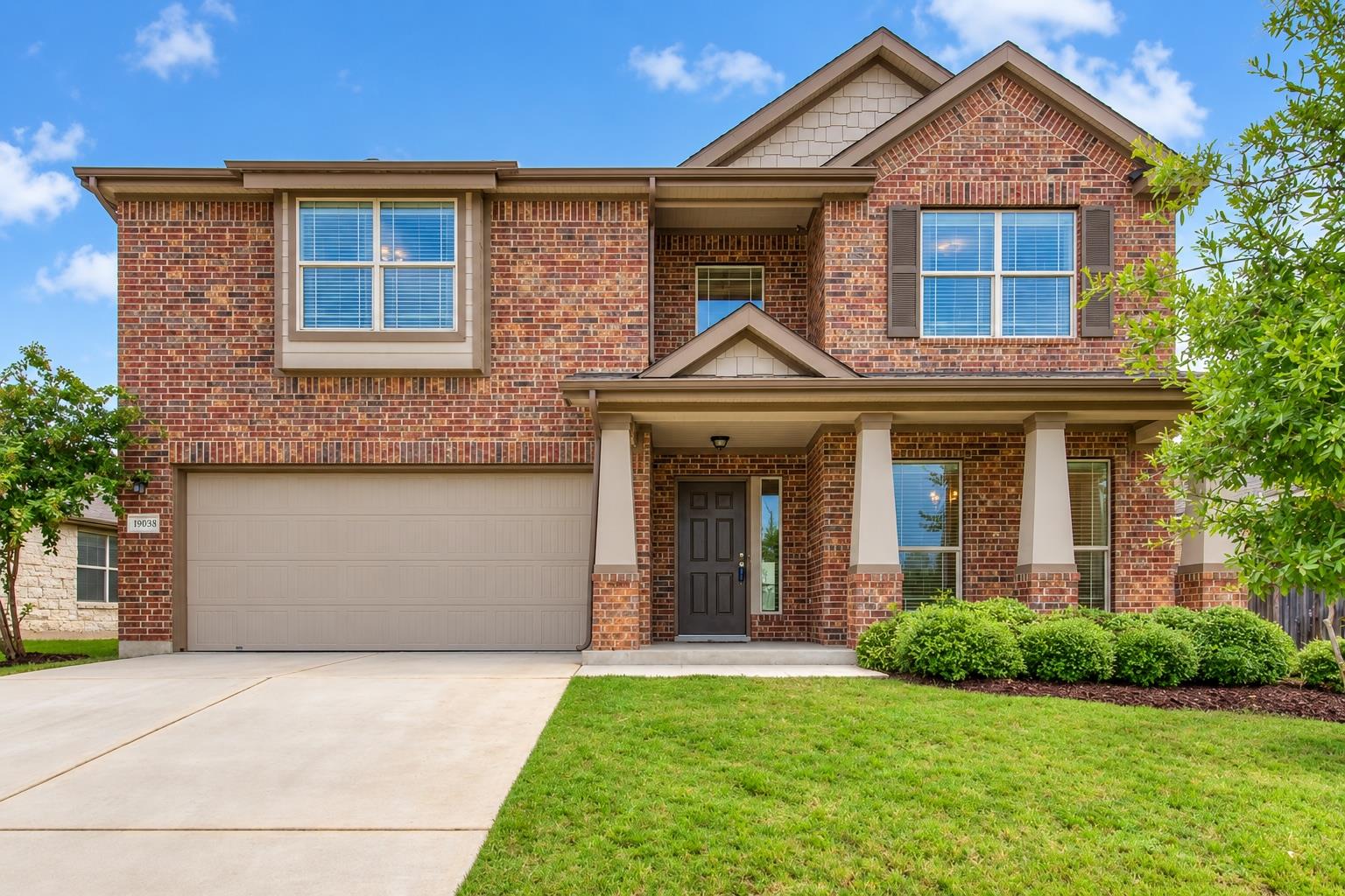 Classic brick craftsmanship defines this two-stor